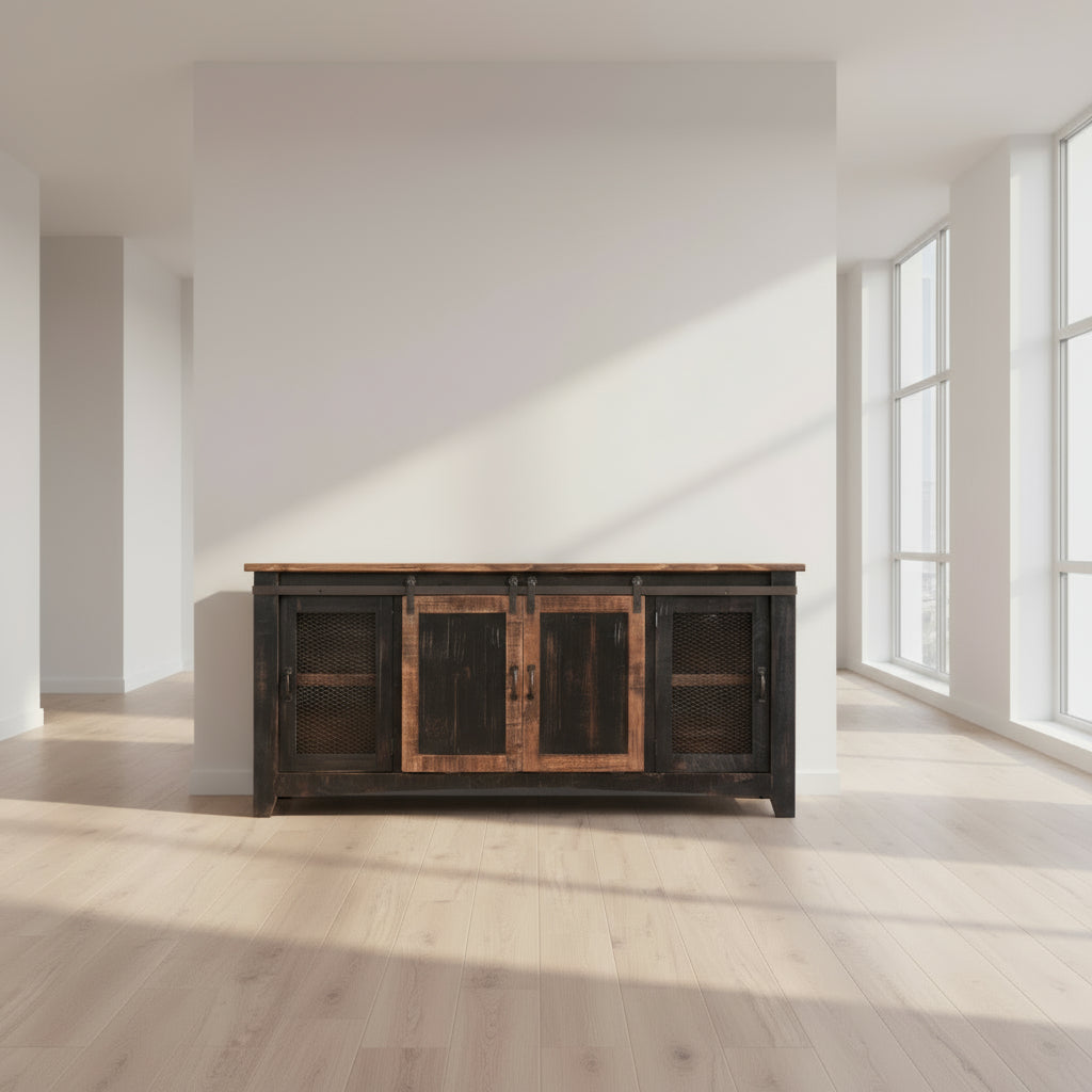 Rustic wooden sideboard against a brick wall with decorative items on top.