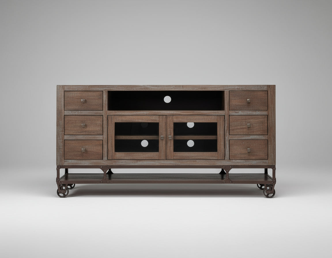 Wooden entertainment console with drawers and cabinets on a wooden floor against a beige wall.