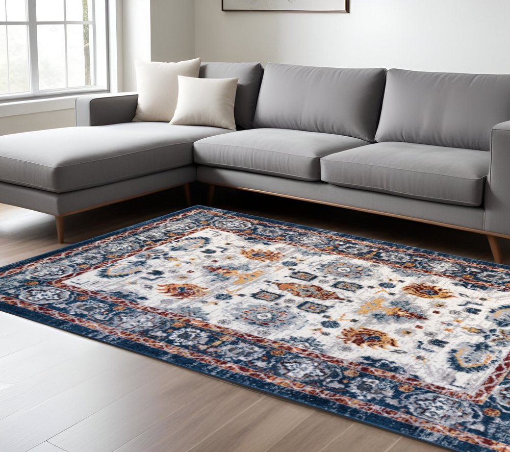 8' X 10' Ivory Navy and Orange Floral Power Loom Area Rug