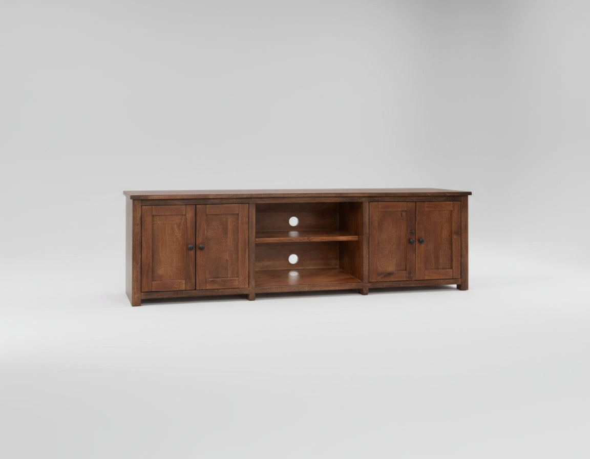 Wooden TV stand with multiple shelves and doors on a white background