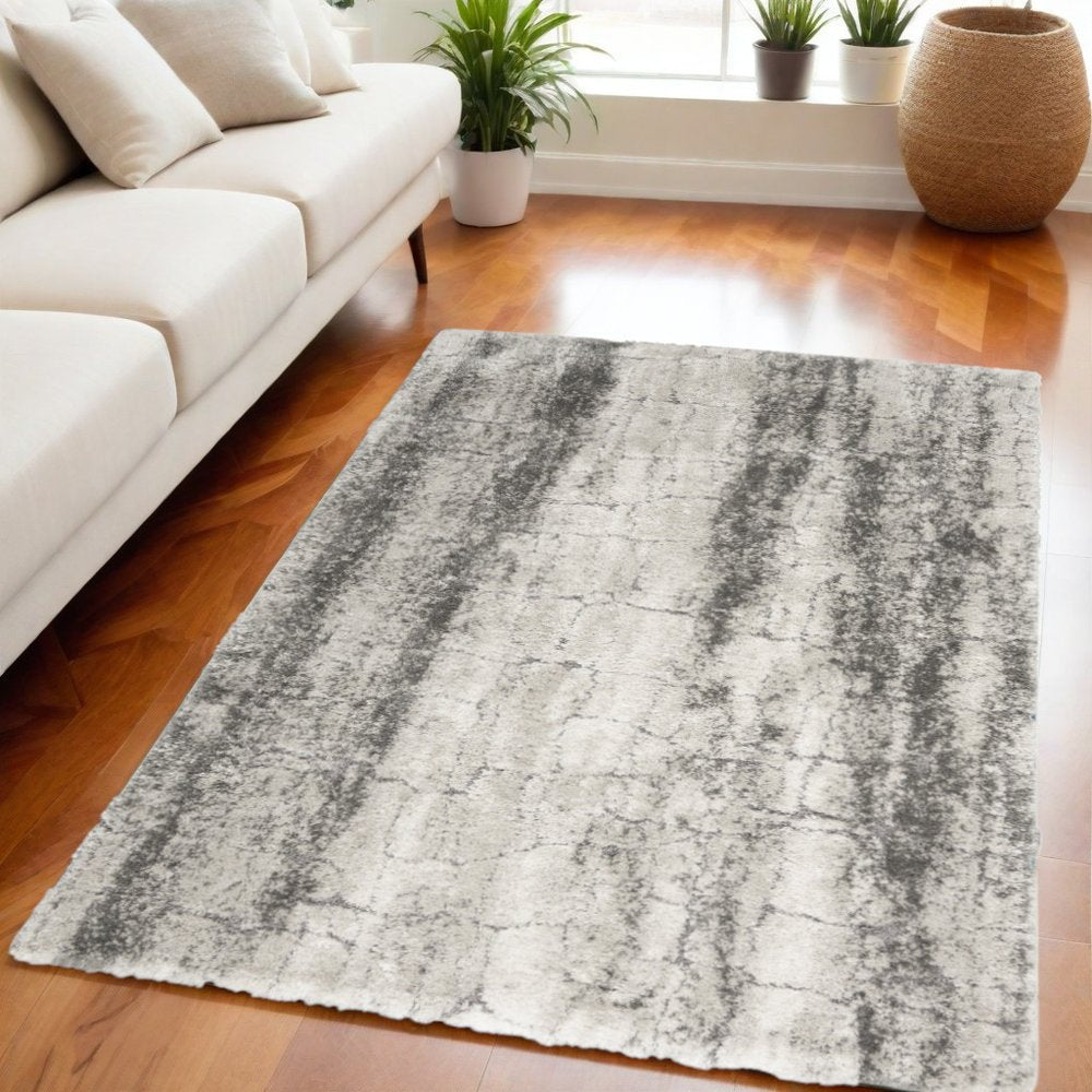 5' X 7' Charcoal and Ivory Abstract Shag Area Rug